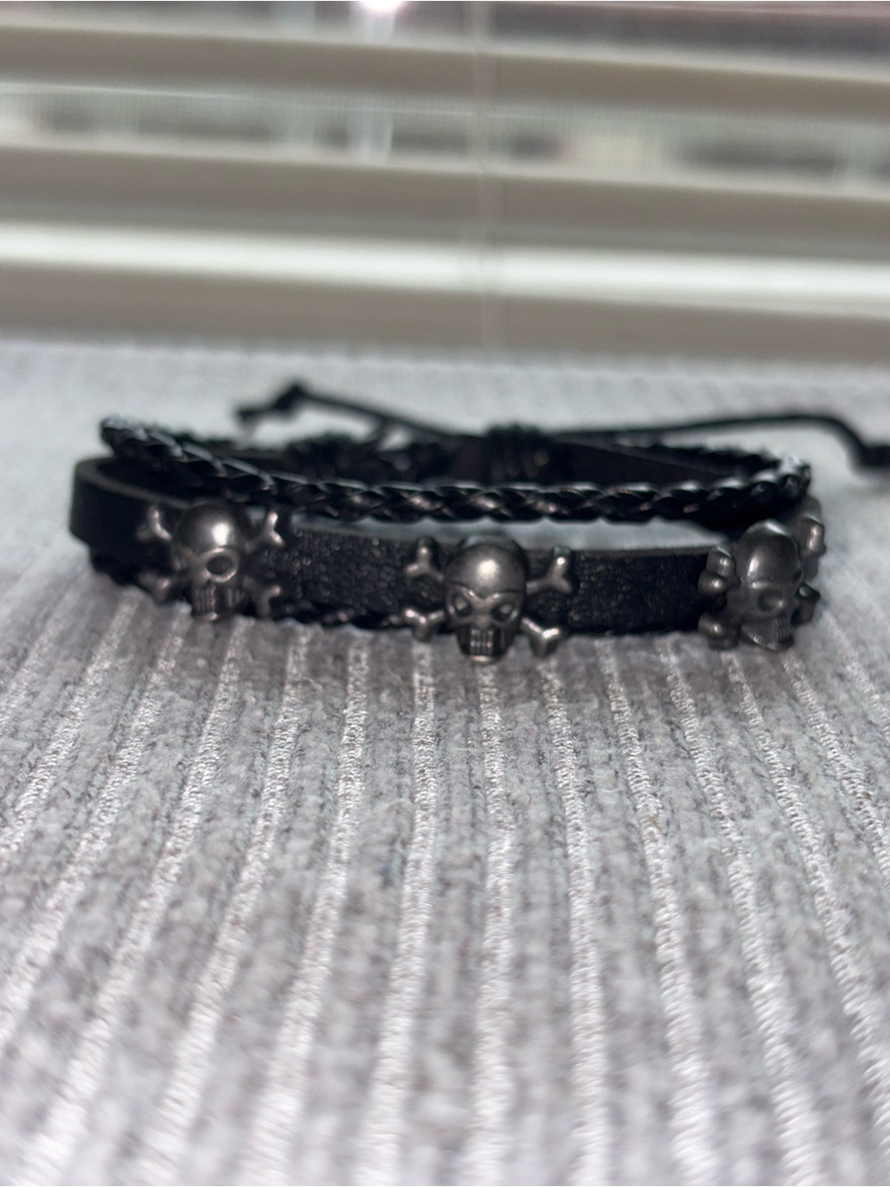 Grunge theme silver tone skull 3-stranded black leather adjustable bracelet